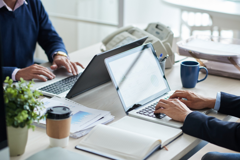 side-view-cropped-unrecognizable-business-people-working-common-desk